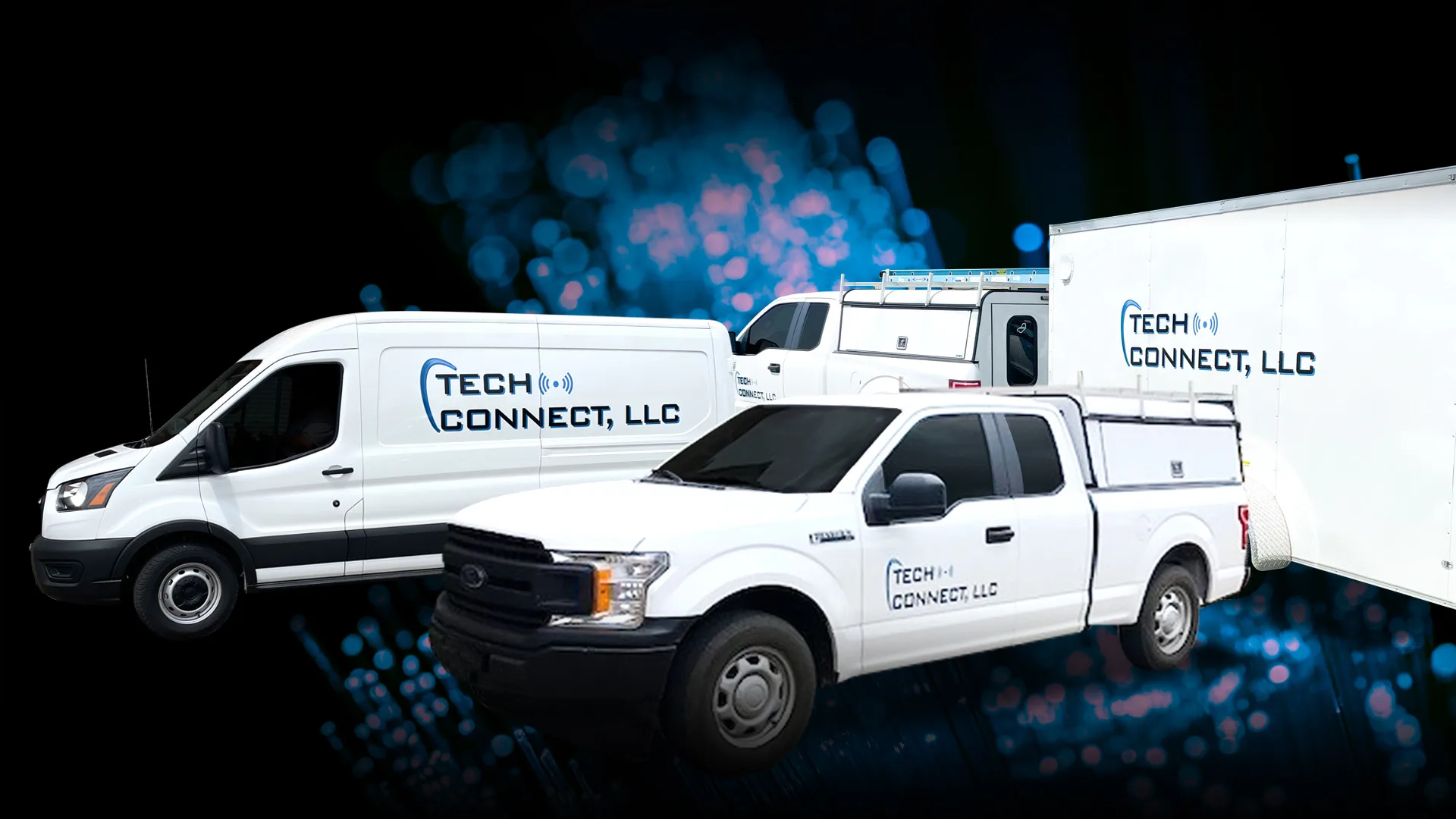 The Tech Connect fleet: a lettered van, pickup and box trailer